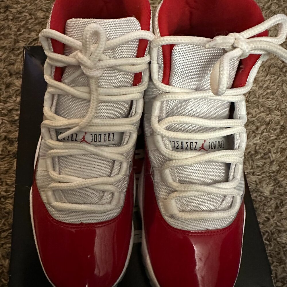 GENTLY USED MENS JORDAN 11 RETROS CHERRY RED